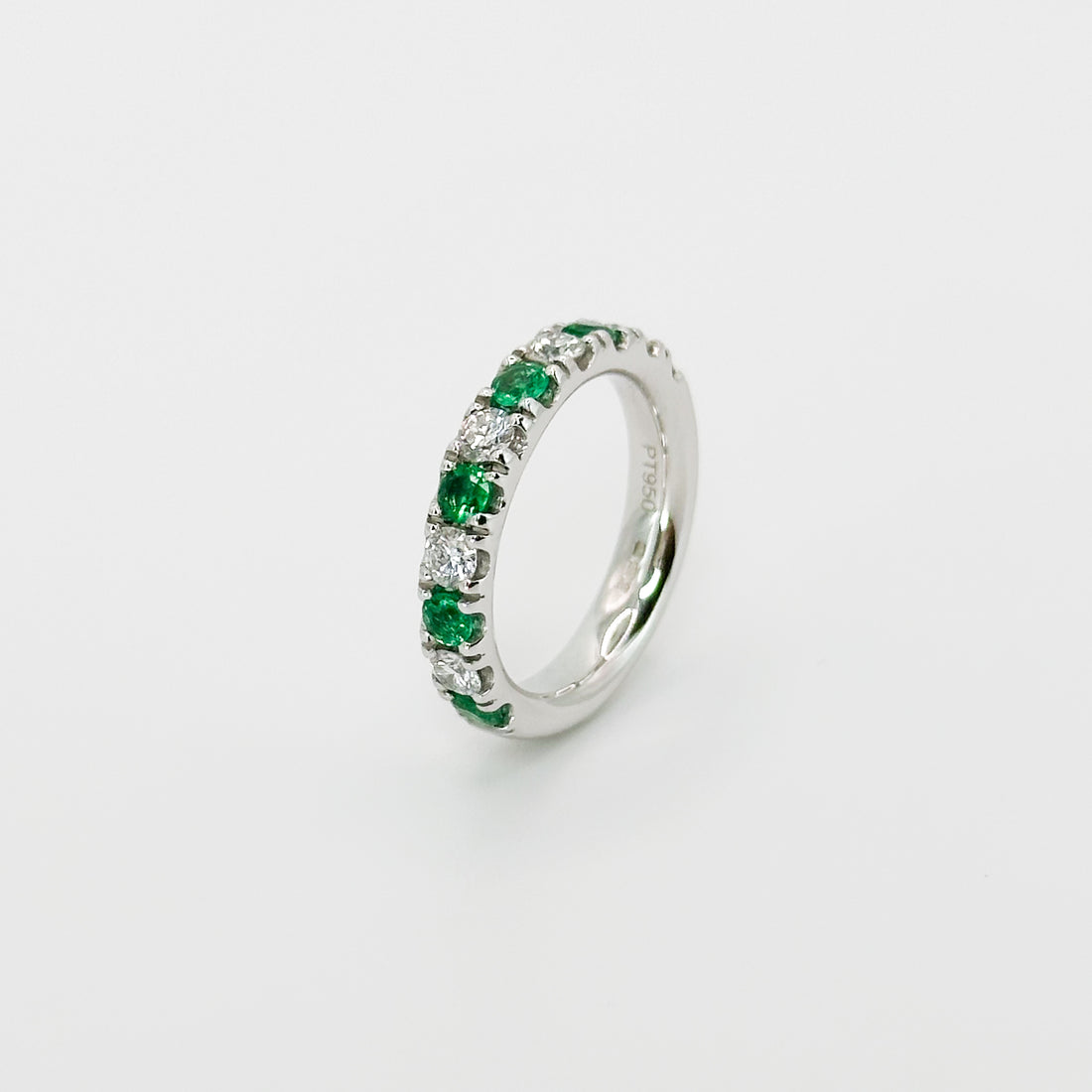 Diamond and Emerald Eternity Ring in Platinum