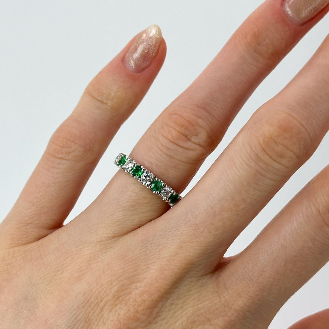 Diamond and Emerald Eternity Ring in Platinum