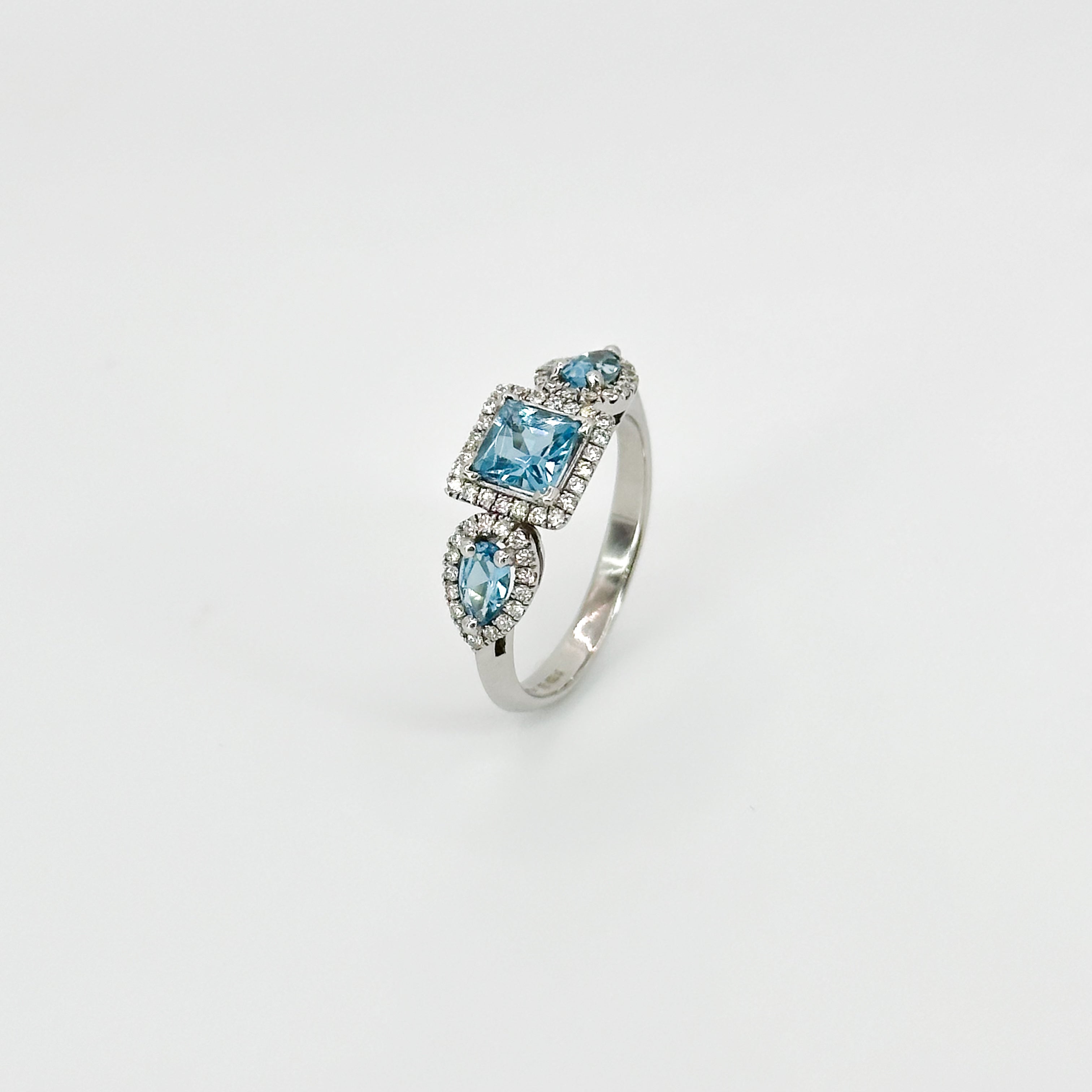 Blue Topaz Trilogy with Diamond Halo