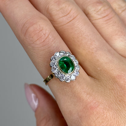 1.90ct Oval Emerald Ring with Bezel and Diamond Halo