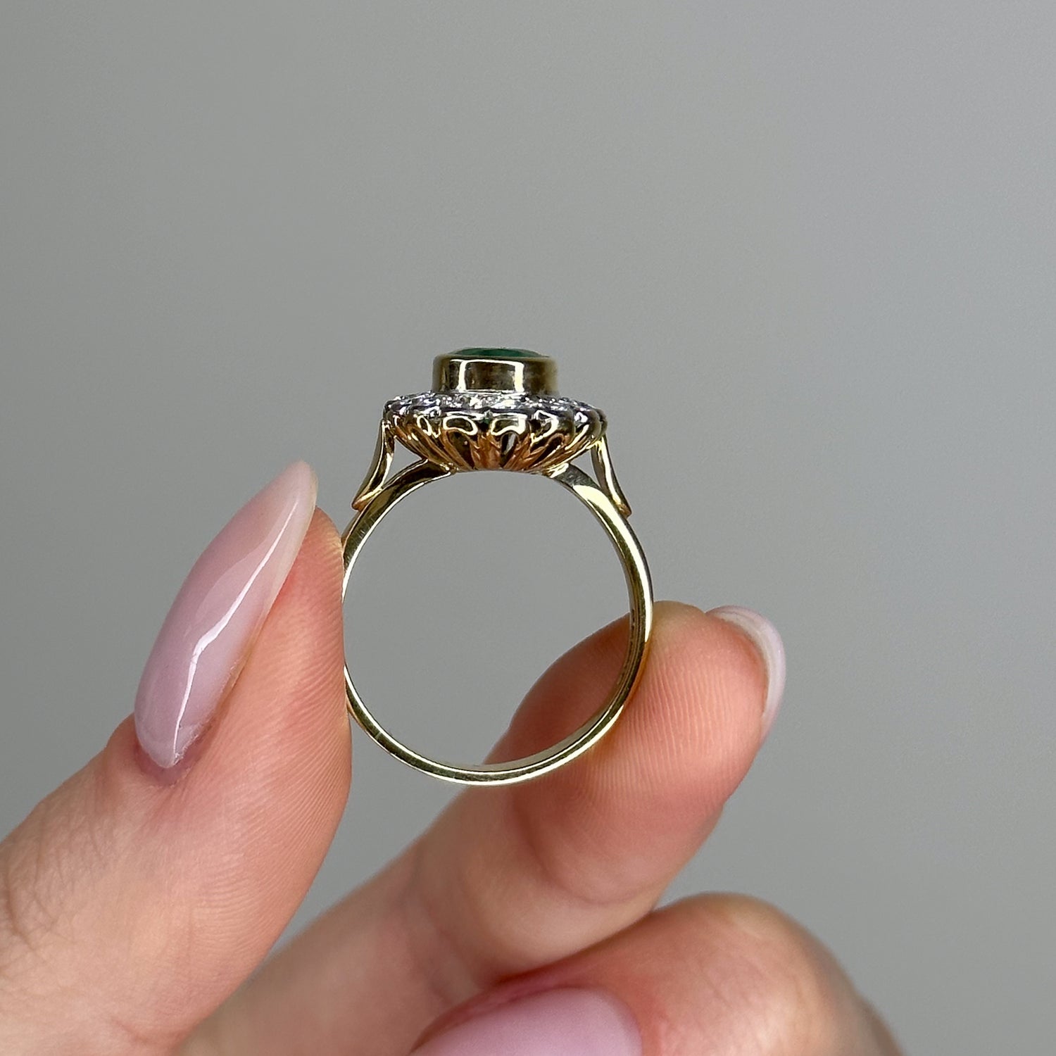 1.90ct Oval Emerald Ring with Bezel and Diamond Halo