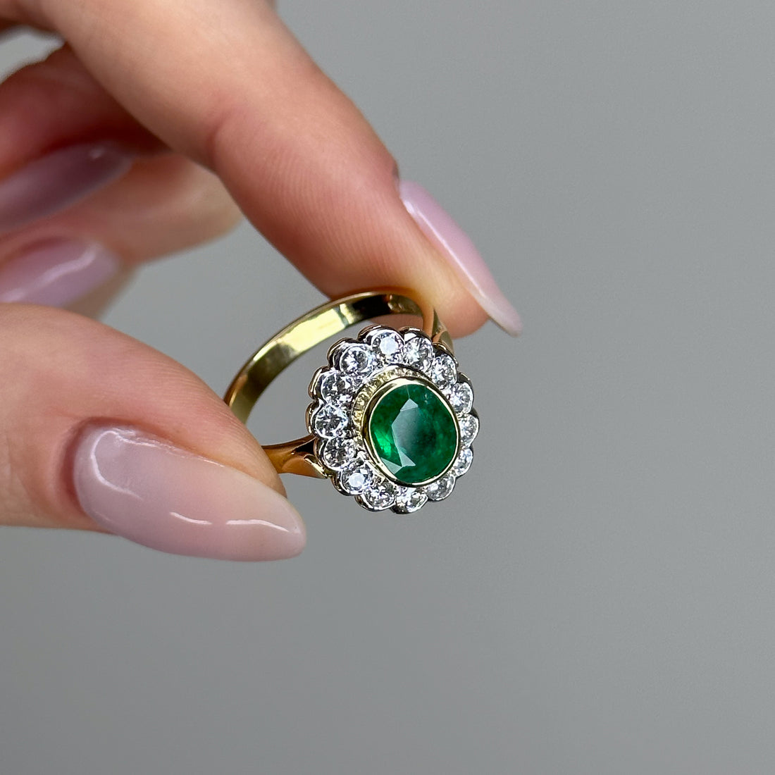 1.90ct Oval Emerald Ring with Bezel and Diamond Halo