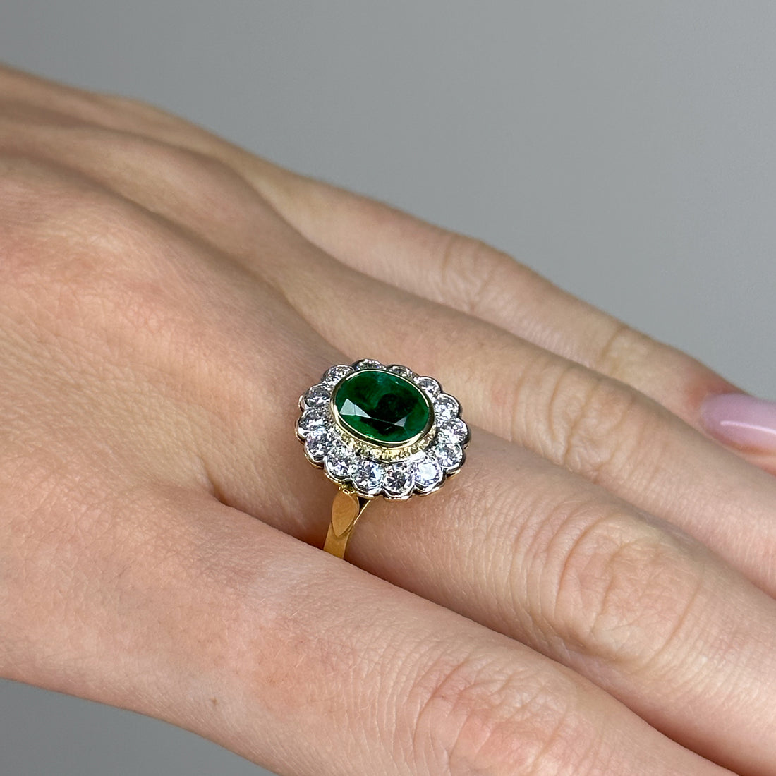 1.90ct Oval Emerald Ring with Bezel and Diamond Halo