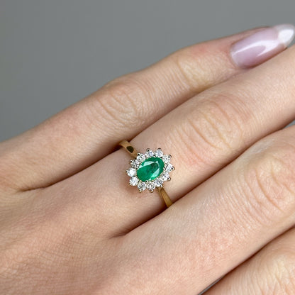 0.60ct Oval Shape Emerald Ring with a Diamond Halo