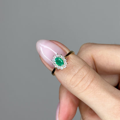 0.60ct Oval Shape Emerald Ring with a Diamond Halo