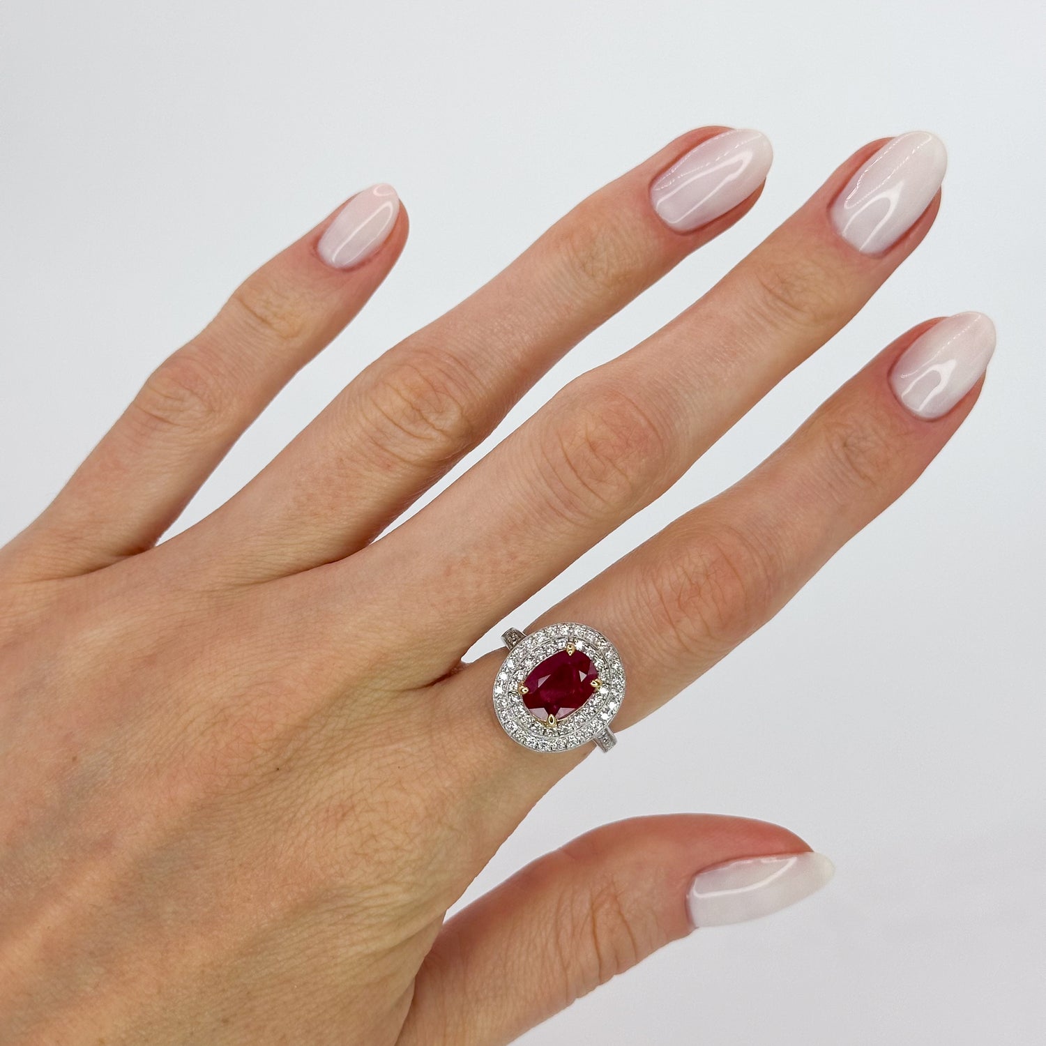 Oval Cut Ruby Ring with Double Halo in White Gold