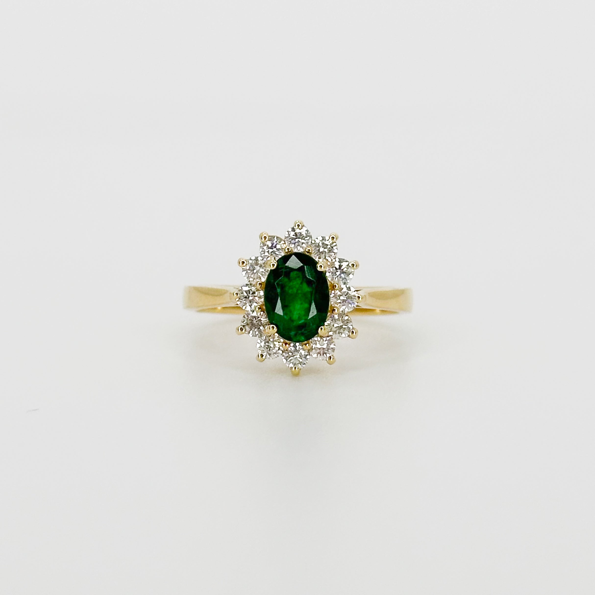 Deep Green Oval Cut Emerald Ring with Diamond Halo