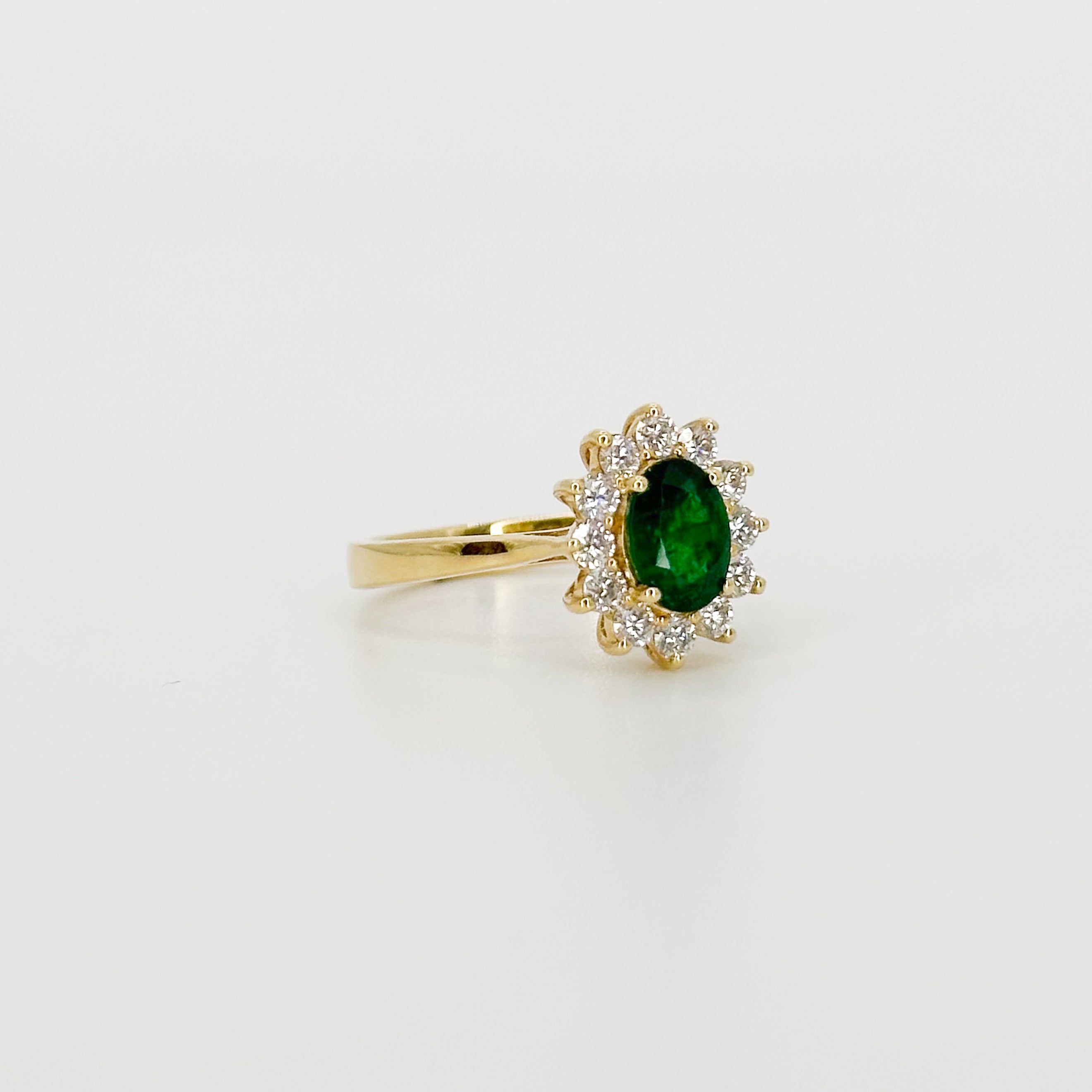 Deep Green Oval Cut Emerald Ring with Diamond Halo