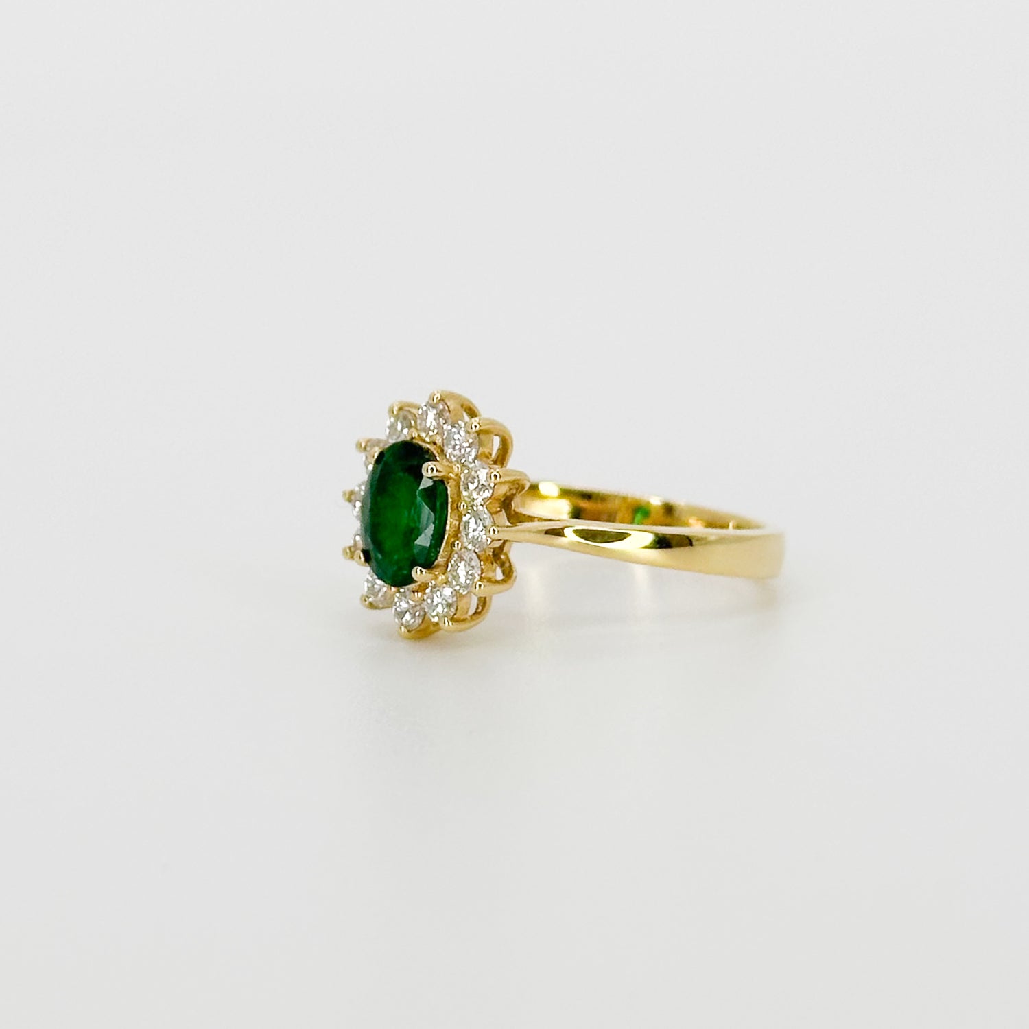 Deep Green Oval Cut Emerald Ring with Diamond Halo