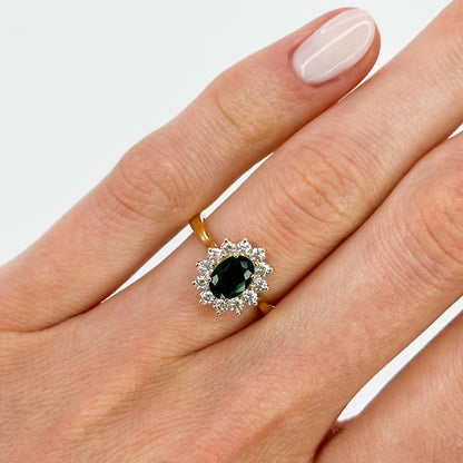 Deep Green Oval Cut Emerald Ring with Diamond Halo