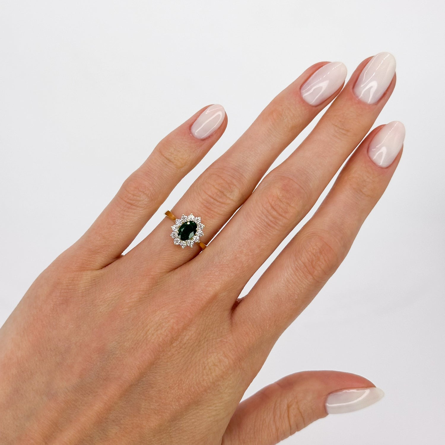 Deep Green Oval Cut Emerald Ring with Diamond Halo